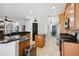 Spacious kitchen with wood cabinets, granite countertops, stainless steel appliances, and an island at 13301 Biscayne Dr, Grand Island, FL 32735