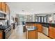 Bright open-concept space with a kitchen and dining area featuring dark granite countertops at 13301 Biscayne Dr, Grand Island, FL 32735