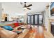 Cozy living room featuring hardwood floors, a fireplace, and access to the screened patio at 13301 Biscayne Dr, Grand Island, FL 32735