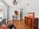 Bright living room boasting hardwood floors, decorative furnishings, and a stylish ceiling fan at 13301 Biscayne Dr, Grand Island, FL 32735
