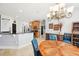 Bright living space featuring an open kitchen, and dining room with stylish furnishings at 13301 Biscayne Dr, Grand Island, FL 32735