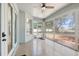 Enclosed sunroom with ceiling fan and bright, airy feel at 13301 Biscayne Dr, Grand Island, FL 32735