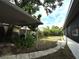 Lush backyard with mature trees and a covered area, providing a serene outdoor space at 1414 Margate Ave, Orlando, FL 32803