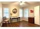 Bedroom with three windows and a ceiling fan, showcasing the room's natural light and charming details at 1414 Margate Ave, Orlando, FL 32803