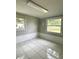 Bonus room with ceramic tile and two windows that provide natural light at 1414 Margate Ave, Orlando, FL 32803