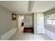 Bonus room with ceramic tile, neutral paint, and doors leading to other rooms at 1414 Margate Ave, Orlando, FL 32803