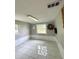 Bonus room with ceramic tile, two windows, a wreath and accent molding at 1414 Margate Ave, Orlando, FL 32803