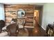 Cozy dining area with unique wood accent wall, stylish decor, and a round jute rug at 1414 Margate Ave, Orlando, FL 32803
