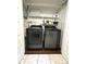 Laundry room featuring a washer and dryer, with storage shelves at 1414 Margate Ave, Orlando, FL 32803
