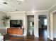 Bright living room with a vintage cabinet and an open doorway at 1414 Margate Ave, Orlando, FL 32803