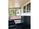 Screened porch featuring a hot tub, offering a private relaxation space at 1414 Margate Ave, Orlando, FL 32803