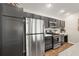 Contemporary kitchen with stainless steel appliances, sleek countertops, and ample cabinet storage at 1486 Joshua Ct, The Villages, FL 32163
