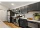 Modern kitchen featuring stainless steel appliances, sleek countertops, and ample cabinet storage at 1486 Joshua Ct, The Villages, FL 32163