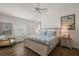 Comfortable main bedroom with natural light, ceiling fan and ensuite bathroom at 1486 Joshua Ct, The Villages, FL 32163
