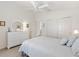 Airy bedroom featuring neutral walls, a ceiling fan, and ample closet space for optimal storage at 1486 Olympia St, The Villages, FL 32163