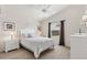 Cozy bedroom featuring neutral walls, a ceiling fan, and window with blackout curtains for restful nights at 1486 Olympia St, The Villages, FL 32163