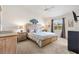 Serene main bedroom with a king-sized bed, stylish decor, and a view of the outdoors at 1486 Olympia St, The Villages, FL 32163