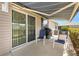Relax on the covered patio with awning, enjoy the outdoor seating and grilling area perfect for entertaining guests at 1486 Olympia St, The Villages, FL 32163