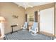 Cozy porch featuring neutral walls, a ceiling fan, and comfortable seating for relaxation at 1486 Olympia St, The Villages, FL 32163