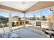 Bright sunroom with expansive windows offering scenic views, comfortable seating and tranquil ambiance at 1486 Olympia St, The Villages, FL 32163