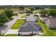 A home with a well-kept lawn, set within a peaceful community with mature trees and well-maintained streets at 17036 Se 79Th Clearview Ave, The Villages, FL 32162