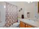 Bright bathroom featuring a tub-shower combo, tile flooring, and a neutral color scheme at 17036 Se 79Th Clearview Ave, The Villages, FL 32162