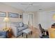 Cozy bedroom with a ceiling fan, neutral walls, and light-colored wood flooring for a soothing ambiance at 17036 Se 79Th Clearview Ave, The Villages, FL 32162