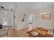 Welcoming entryway with wood floors, stylish decor, and arched doorways for a seamless flow at 17036 Se 79Th Clearview Ave, The Villages, FL 32162