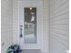 Close-up of the front door entrance, highlighting the details and inviting entryway to the home at 17036 Se 79Th Clearview Ave, The Villages, FL 32162