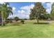 Expansive backyard view overlooking a lush golf course, offering a serene and picturesque setting at 17036 Se 79Th Clearview Ave, The Villages, FL 32162