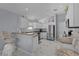 Contemporary kitchen featuring sleek appliances, white cabinets, and stylish countertops at 17036 Se 79Th Clearview Ave, The Villages, FL 32162