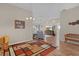 Open-concept living space with vaulted ceilings, showcasing wood floors and cozy seating at 17036 Se 79Th Clearview Ave, The Villages, FL 32162