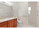 Bathroom features a walk-in shower and grab bars for accessibility at 1721 Sunset Ridge Dr, The Villages, FL 32162