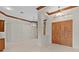 Bright foyer with grand chandeliers and large wooden front door at 1721 Sunset Ridge Dr, The Villages, FL 32162