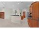 Spacious kitchen with granite countertops and stainless steel appliances at 1721 Sunset Ridge Dr, The Villages, FL 32162