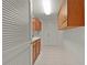 Laundry room features ample storage cabinets and white appliances at 1721 Sunset Ridge Dr, The Villages, FL 32162