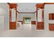 Open living room featuring built in wood shelving and view of outdoor area at 1721 Sunset Ridge Dr, The Villages, FL 32162