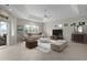 Comfortable living room with neutral colors, tile flooring, and natural light at 1721 Sunset Ridge Dr, The Villages, FL 32162