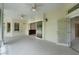 Open patio with tiled flooring, ample natural light, and access to the interior through sliding glass doors at 1721 Sunset Ridge Dr, The Villages, FL 32162