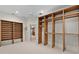 Large walk-in closet with custom-built shelving, a ceiling fan, and tile flooring at 1721 Sunset Ridge Dr, The Villages, FL 32162