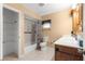 An interior bathroom featuring a shower-tub combo, toilet, and vanity with a sink at 17587 Se 95Th Cir, Summerfield, FL 34491