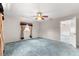 Bedroom showing a ceiling fan, window with curtains, and an open door at 17587 Se 95Th Cir, Summerfield, FL 34491