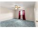 Large bedroom with carpeting, neutral walls, and natural light from the window at 17587 Se 95Th Cir, Summerfield, FL 34491