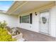 Charming front entryway with a decorative glass door and brick paver walkway at 17587 Se 95Th Cir, Summerfield, FL 34491