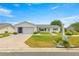 Charming single-story home featuring a brick driveway, well-maintained lawn and inviting curb appeal at 17587 Se 95Th Cir, Summerfield, FL 34491