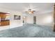 A view of the living room showing the open layout with a kitchen in the background at 17587 Se 95Th Cir, Summerfield, FL 34491
