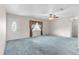Living room featuring natural light, a ceiling fan, and neutral-colored walls at 17587 Se 95Th Cir, Summerfield, FL 34491