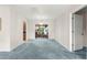 Bright living room with chandelier and view of rear yard at 17587 Se 95Th Cir, Summerfield, FL 34491