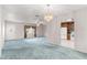 Spacious living room adjacent to a kitchen area, offering an open floor plan at 17587 Se 95Th Cir, Summerfield, FL 34491