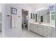 Ensuite bathroom featuring a toilet, shower, vanity with a sink, and storage inside the cabinets at 1875 Saybrook Way, The Villages, FL 32162